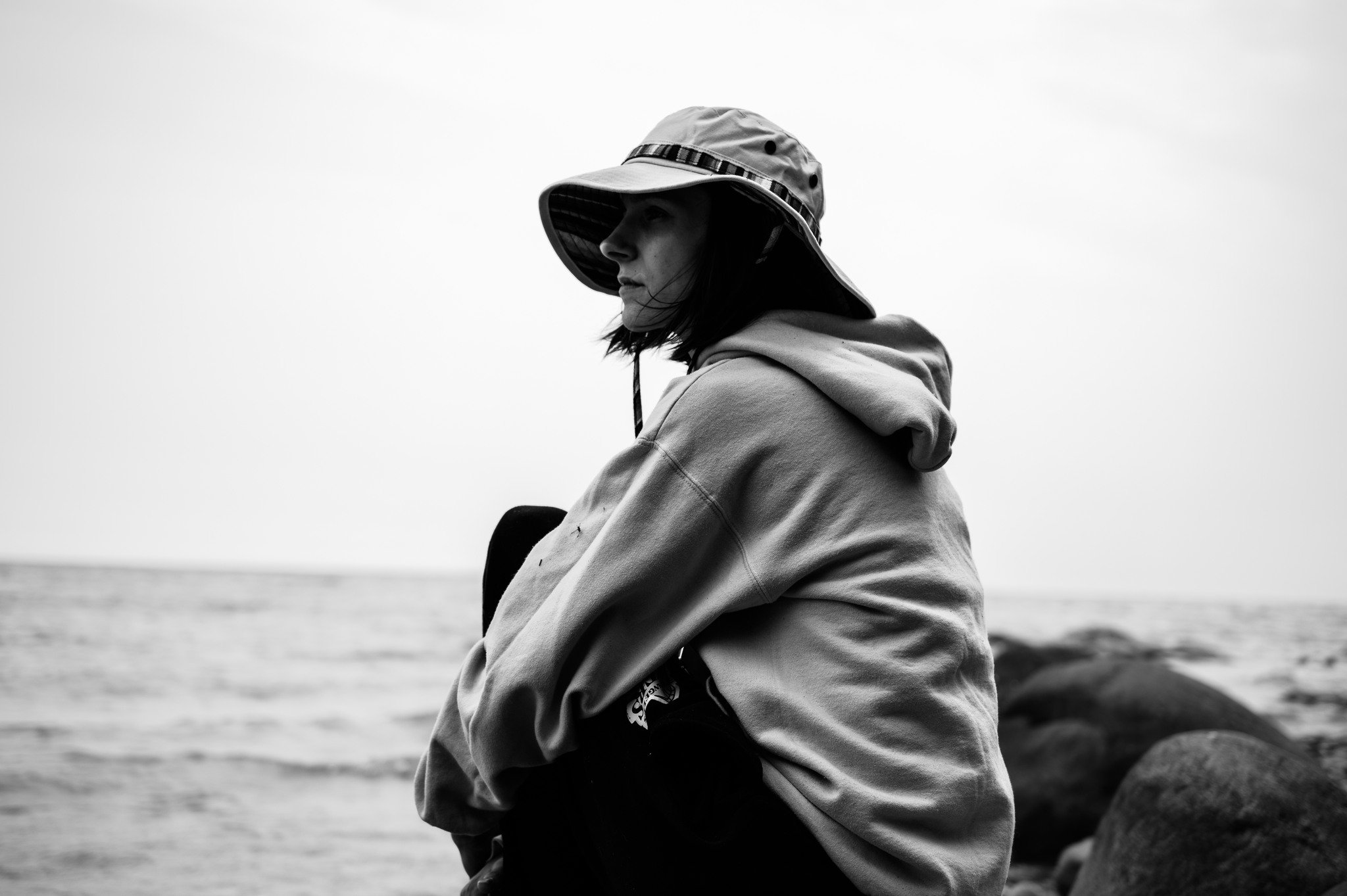 A portrait of a woman by a lake.