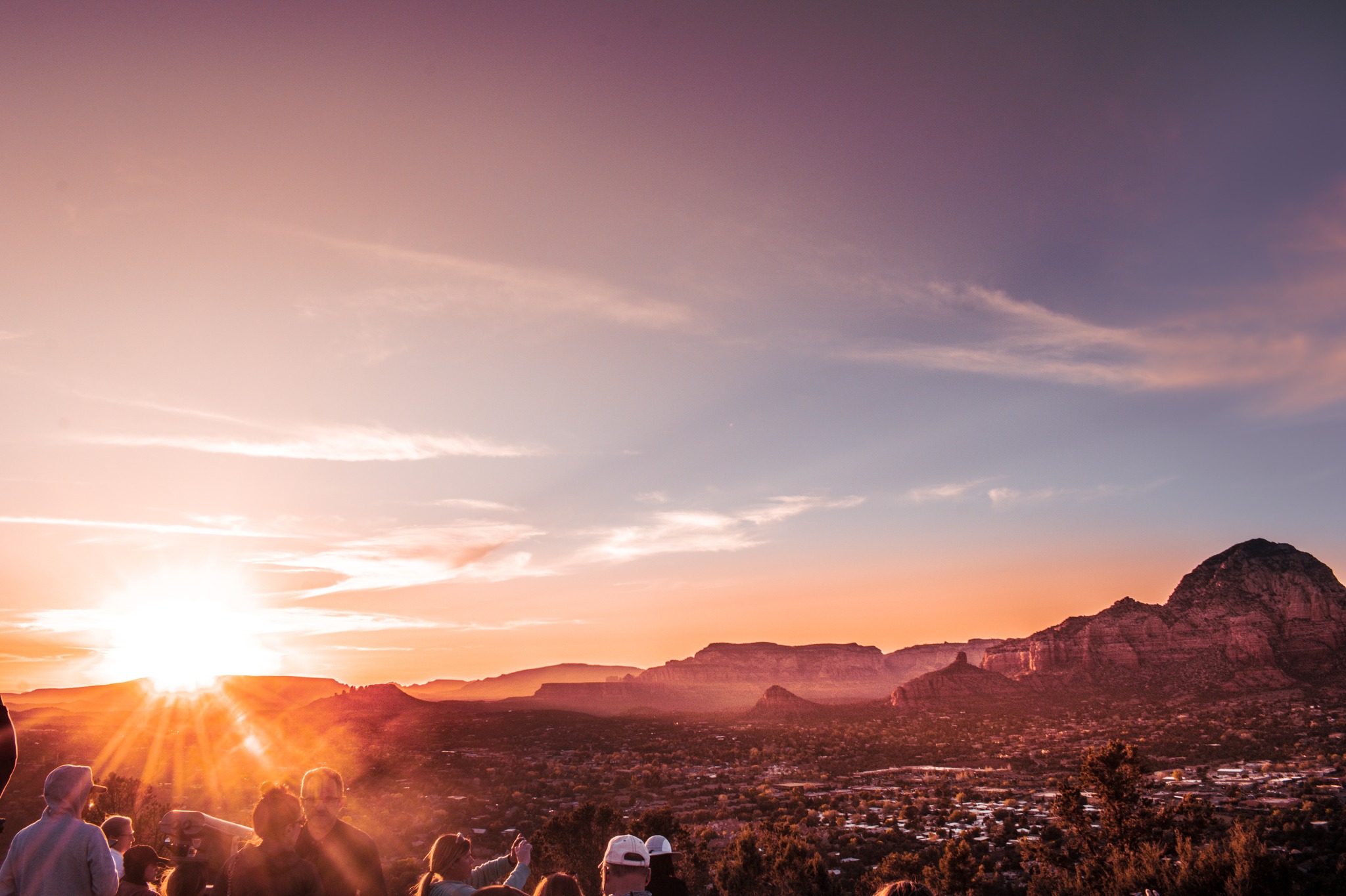 Tourists and sunset lovers alike join to watch a Sedona,AZ sunset.