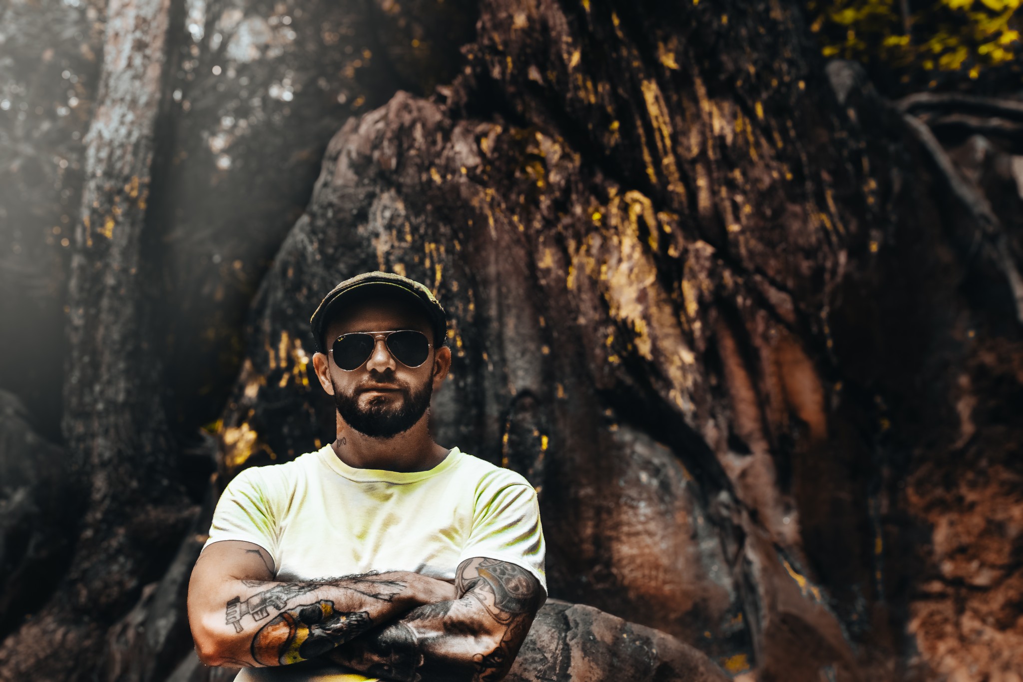 A man standing in front of rocks.